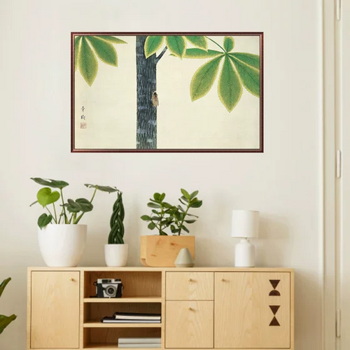 Room interior with wooden cabinet, plants, and framed artwork on the wall.