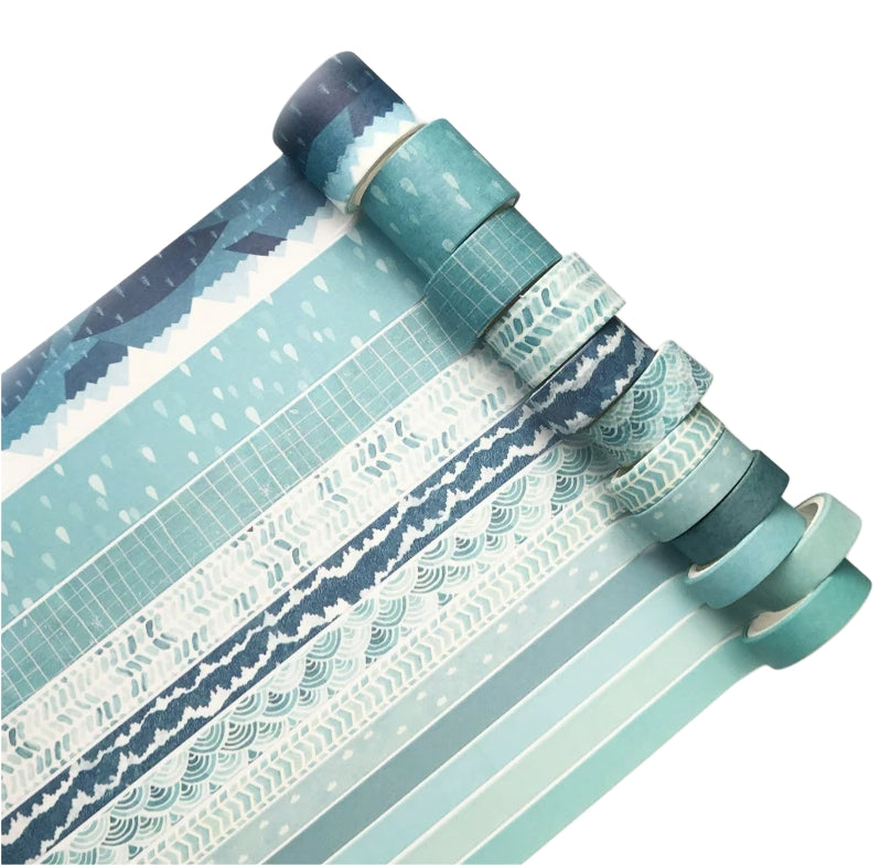 Set of rolls of washi tape with various patterns on a white background