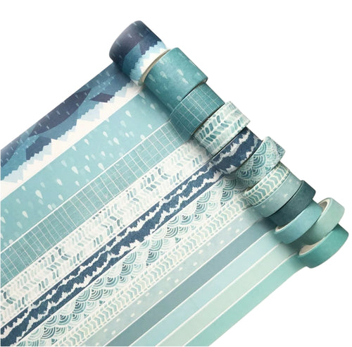 Set of rolls of washi tape with various patterns on a white background