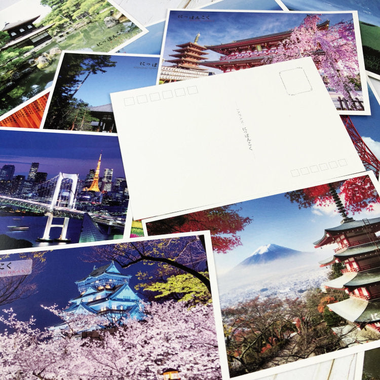 Collection of postcards with scenic views of Japan, including cherry blossoms and Mount Fuji.
