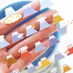 A hand holds a clear sheet of small volcano-shaped stickers or decals in assorted colors, including blue, purple, red, orange, yellow, and white, with some stickers also shown resting on a blue surface.