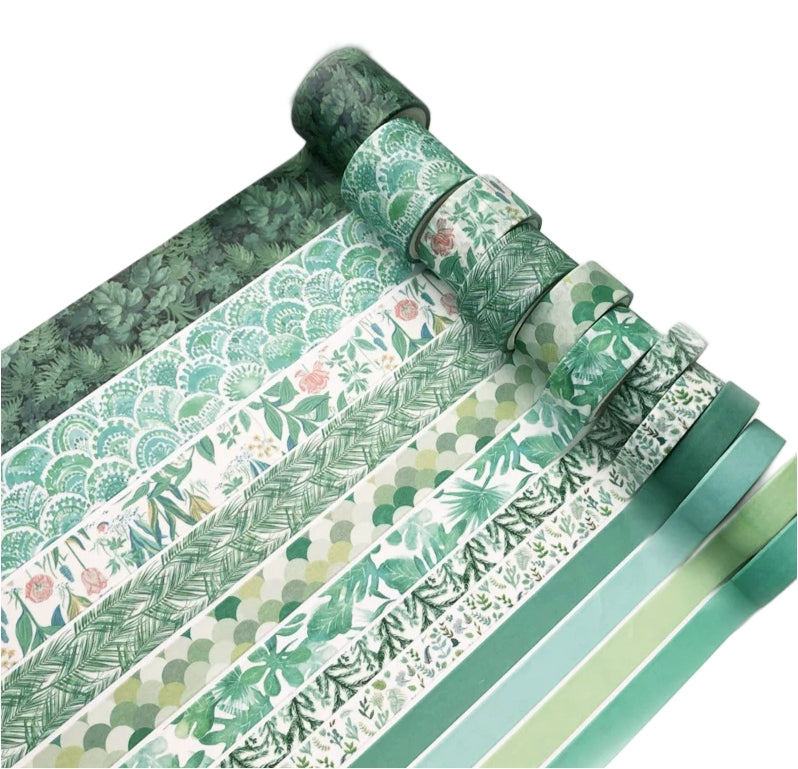 Collection of green patterned paper rolls on a white background