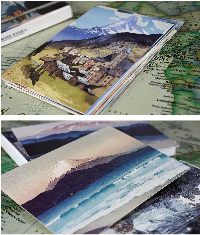 Stack of postcards with mountain and landscape designs 
