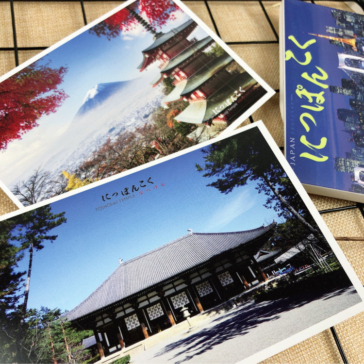 Two postcards showing Japanese architecture and nature on a textured surface.