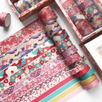 Colorful washi tape rolls with floral and abstract designs on a white background