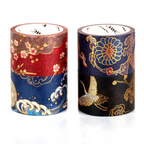 4 rolls of decorative washi tape with traditional Japanese patterns, one stacked horizontally in red, pink, and blue with gold floral and wave designs, and the other stacked vertically in navy, gold, and black with a crane and floral motifs.