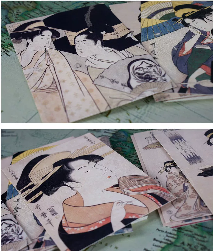 Collection of Japanese woodblock prints on a textured surface