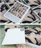 Collection of books with traditional Japanese art illustrations on a textured surface.