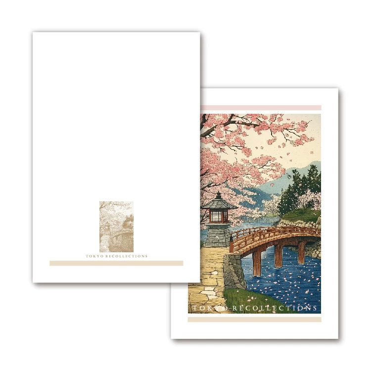 Two greeting cards with cherry blossom and bridge design on a white background