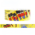 A roll of decorative washi tape featuring a repeating pattern of British guards in red jackets and blue trousers on a bright yellow background, with Japanese text printed on the side.