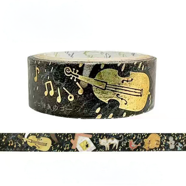 A roll of decorative washi tape with a black background, gold violin and musical note pattern, and a strip sample shown below on a white background.
