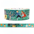 A roll of decorative washi tape featuring a whimsical winter forest scene with two children, trees, snow, and Japanese text. A strip of the tape is shown unrolled below the main roll on a plain white background.