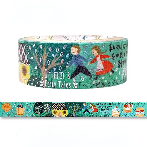 A roll of decorative washi tape featuring a whimsical winter forest scene with two children, trees, snow, and Japanese text. A strip of the tape is shown unrolled below the main roll on a plain white background.