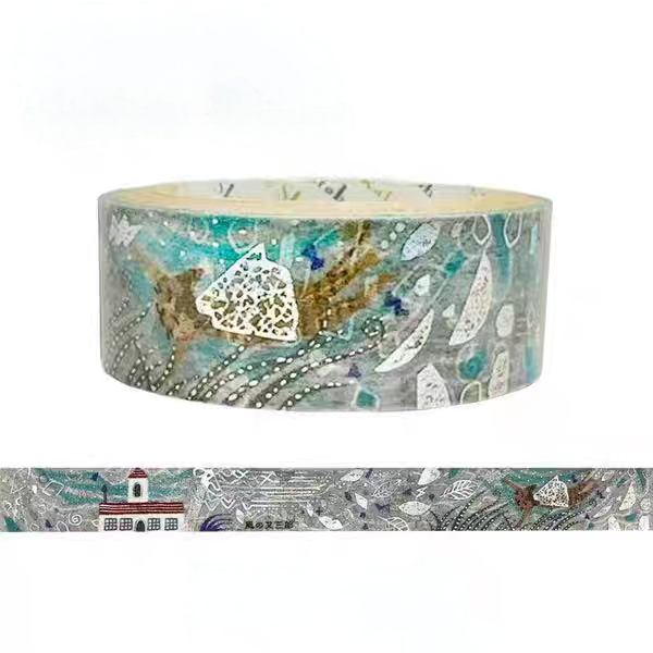 A roll of decorative washi tape with an abstract coastal pattern in teal, gray, white, and gold, shown above a flat strip preview of the same pattern on a white background.