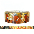 A roll of decorative washi tape featuring an illustration of foxes in a forest with gold foil accents, shown above a close-up strip of the pattern on a white background.