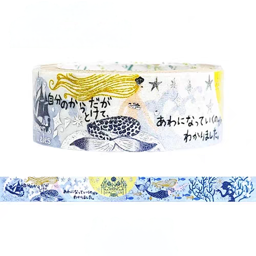 A roll of decorative washi tape with an illustrated mermaid design, shown on a white background with a horizontal strip of the pattern below. The tape features a mermaid with yellow hair, a blue and white patterned tail, stars, and Japanese text.