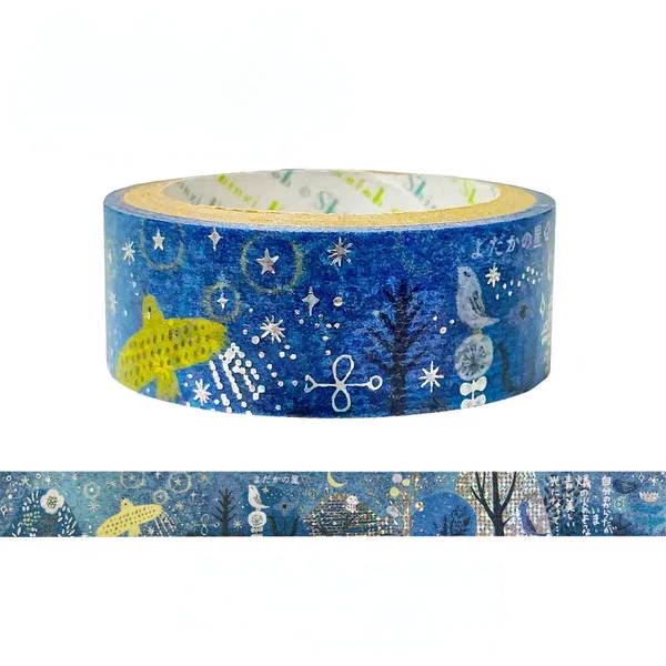 A roll of decorative washi tape with a blue winter night pattern featuring stars, a yellow bird, and a white owl, shown on a white background with a strip of the tape unrolled below.