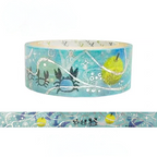 A roll of decorative washi tape with a blue ocean-themed pattern featuring crabs, a yellow fish, white waves, and script text, shown with a flat strip preview below on a white background.