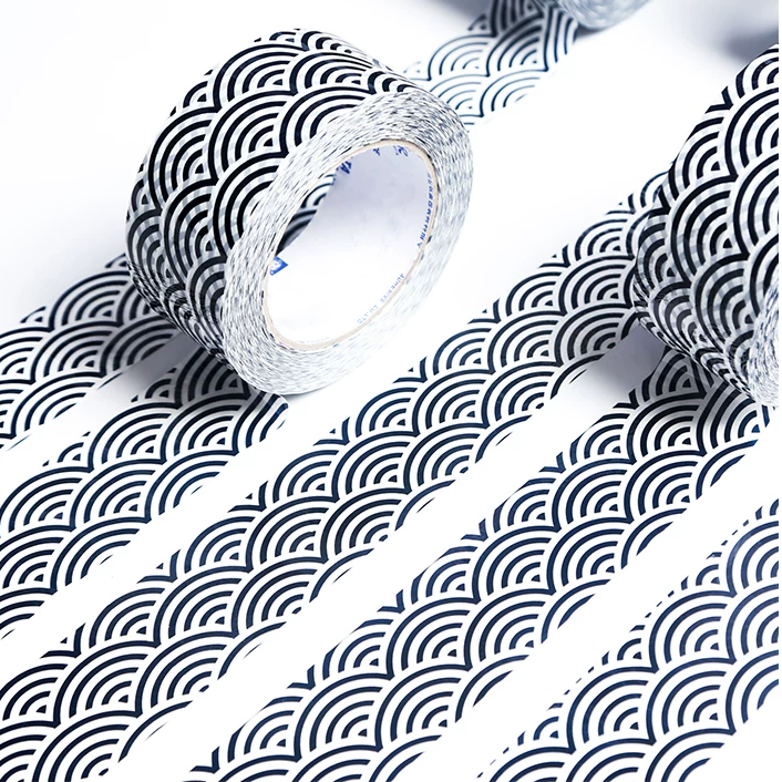 Rolls of tape with wave pattern on a white background