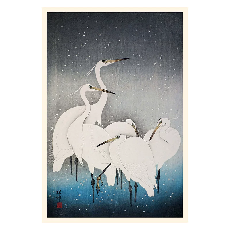 Framed artwork of white cranes in a snowy landscape