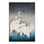 Framed artwork of white cranes in a snowy landscape