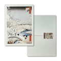 Greeting card with a snowy landscape design featuring a bridge and trees, accompanied by an envelope.